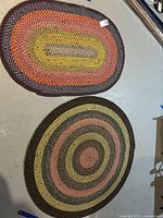 Both rugs together showing shape, size comparison