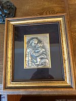 Front view of framed sterling silver Madonna and Child artwork