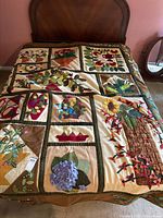 Full view of quilt on bed showing overall design and size