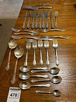 All 30 Rhapsody flatware pieces arranged on table