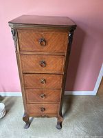 Front view of five-drawer wooden lingerie chest