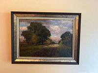 Full view of framed oil painting hanging on wall