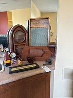 Group shot showing washboard, arched shelf, mantle clock, small decor items