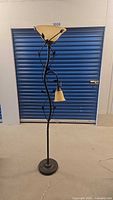 Full view of metal vine floor lamp showing torchiere and side task light