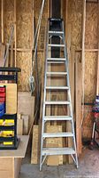 Full view of 10-ft Louisville aluminum A-frame ladder standing in workshop