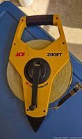 Front view showing Ace branding, 200FT marking and rewind crank