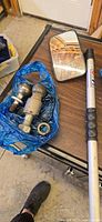 Overview of lot showing hitch finder pole, mirror, two hitch balls in bag, nut/washer