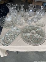 Group view of all crystal and glass items laid on table