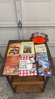 All cookbooks, lobster bib packs, crab décor on table