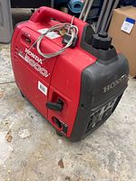 Left front and side view showing model graphics and carry handle