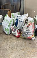 Group of partial garden supply bags