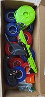 Box contents showing tapetool, tape rolls, staple box and fasteners