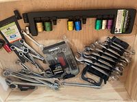 Drawer view showing impact socket rail, multiple wrench sets, Husky bit kit, extension bar