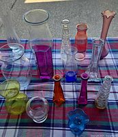 Overhead view of all vases laid out on plaid cloth
