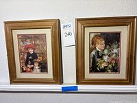 Both framed Renoir prints side by side on wall