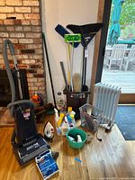 Overview of all items: vacuum, heater, iron, cleaners, long-handle tools