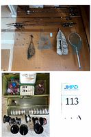 Pegboard view showing four rods, two nets, minnow trap, vest