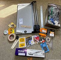 Overview with Rotatrim cutter, ruler, boxed tacking iron, tapes, hardware box