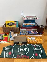 Group shot of all games, mat, backgammon, mahjong tiles, poker chip carousel, Jenga