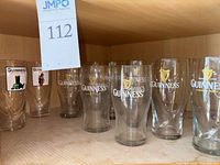 View of all Guinness glasses arranged on shelf