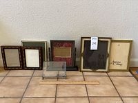 All seven frames lined up with ruler for scale