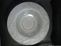 Top view showing entire frosted glass bowl on dark background