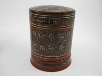 Full view of cylindrical lacquer betel box with lid on