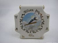 Front view showing ski jumper design and inscription