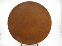 Front view of round redwood plate showing grain and overall condition