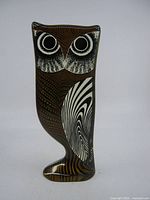 Front view showing brown translucent side with white wing pattern and large eyes