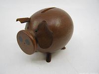 Front left view showing overall shape, missing tail, damaged ear