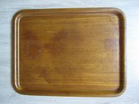 Top view of Ladybird teak tray showing overall shape and wear