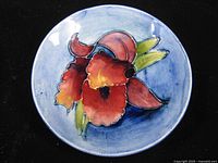 Top view of Moorcroft orchid pin dish showing floral decoration