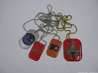 All four NHL dog tags with chains displayed