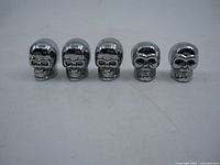 Front view showing five chrome skull caps