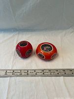 Both paperweights with ruler for scale