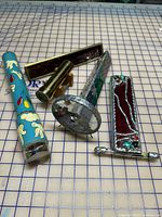 All five kaleidoscopes arranged on grid surface