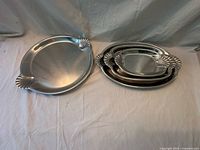 Round tray and three nested oval trays