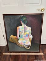 Full view of framed painting with ruler for scale