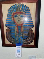 Full view of framed papyrus showing Mask of Tutankhamun artwork