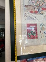 Full view of framed still life print with tape measure indicating height