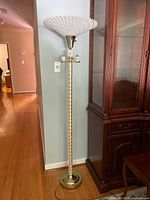 Full view of brass torchiere floor lamp