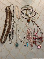 All necklaces laid out showing variety and count