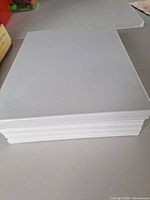 Stack of six blank canvases