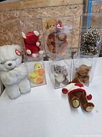 Group shot of all seven Ty Beanie Babies with five in boxes, two loose