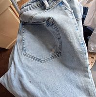 Light wash denim jeans pocket detail