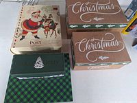 All five decorative Christmas boxes closed