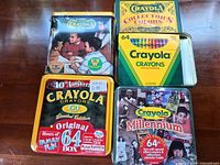 All four Crayola collectible tins grouped