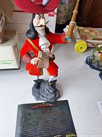 Full view of Captain Hook figurine with certificate
