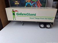 Full left side view showing Green Giant logo, character and slogan